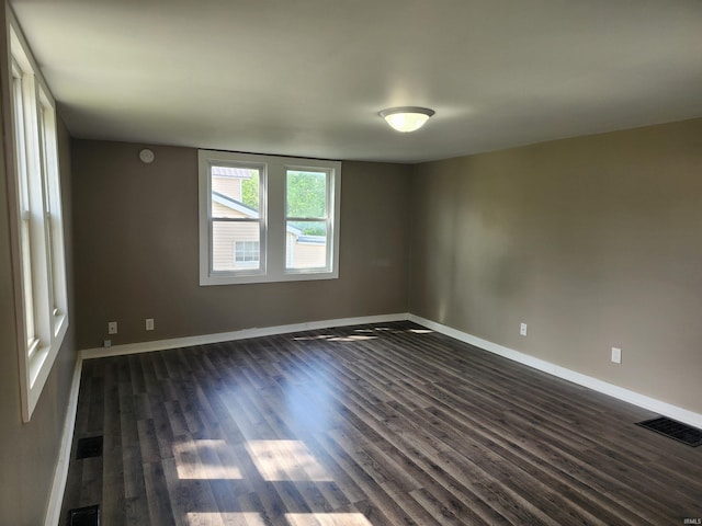 1241 S Main St, Wolf Lake, IN 46796 - unfurnished room with dark wood-style floors and baseboards