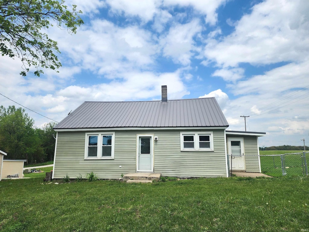 1241 S Main St, Wolf Lake, IN 46796 - back of house featuring metal roof and a chimney