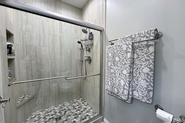 bathroom featuring a stall shower