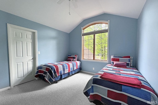 carpeted bedroom featuring lofted ceiling, a ceiling fan, and baseboards