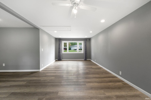 empty room featuring attic access, ceiling fan, wood finished floors, recessed lighting, and baseboards