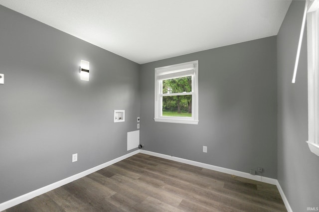 empty room featuring dark wood-style floors and baseboards