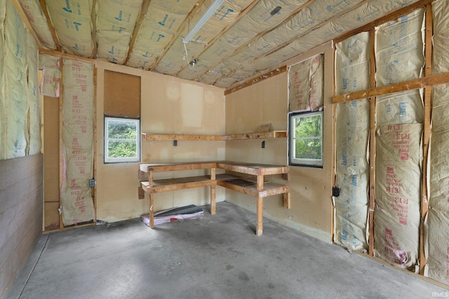 misc room with concrete flooring