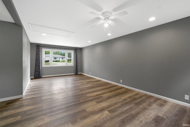 unfurnished room with attic access, ceiling fan, dark wood finished floors, baseboards, and recessed lighting