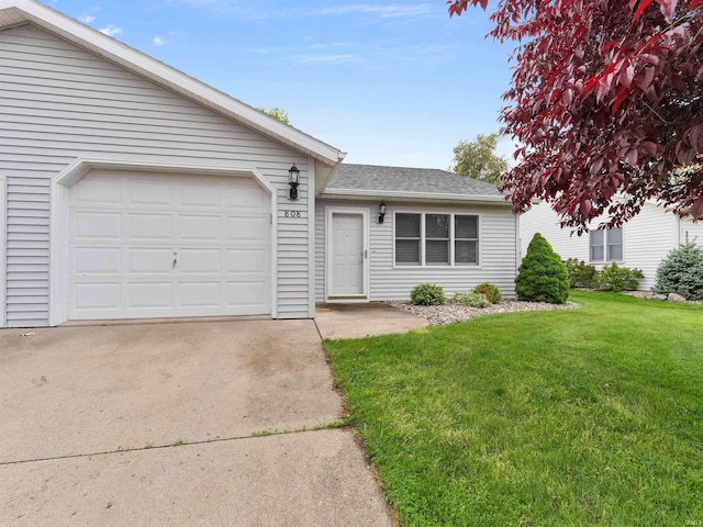 ranch-style house with a front yard, roof with shingles, concrete driveway, and a garage