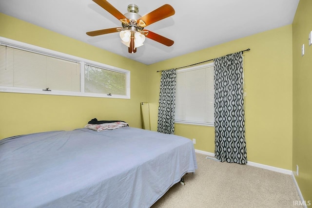 3016 S E Lake Dr, Elkhart, IN 46514 - bedroom with baseboards, carpet floors, and ceiling fan