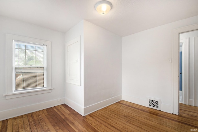241 E Fairview Ave, South Bend, IN 46614 - spare room featuring wood finished floors and baseboards