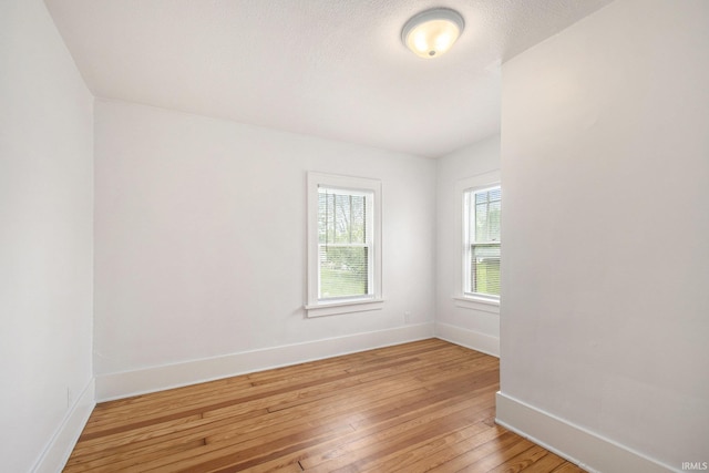 241 E Fairview Ave, South Bend, IN 46614 - spare room featuring baseboards and light wood-style flooring