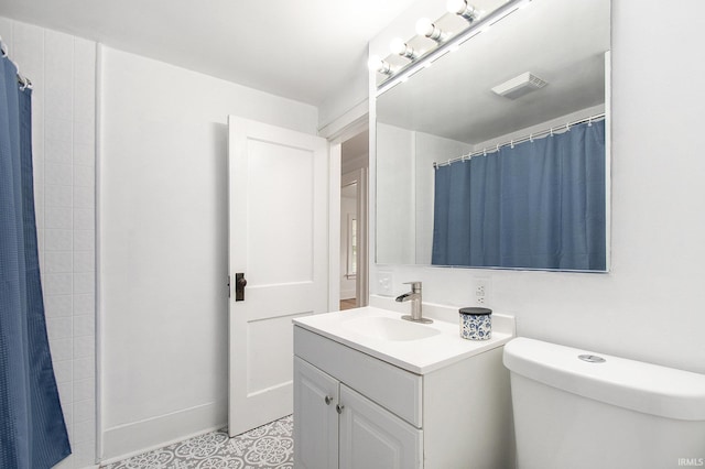 241 E Fairview Ave, South Bend, IN 46614 - bathroom with vanity, toilet, a shower with curtain, and tile patterned floors