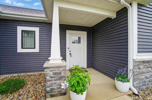 422 Westward Dr, Butler, IN 46721 - doorway to property with a porch and a shingled roof