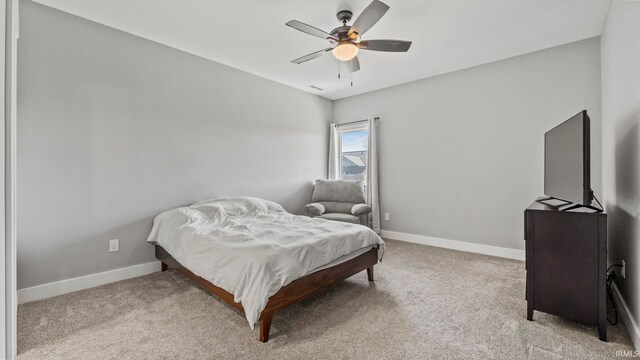 422 Westward Dr, Butler, IN 46721 - bedroom featuring baseboards, carpet floors, and a ceiling fan