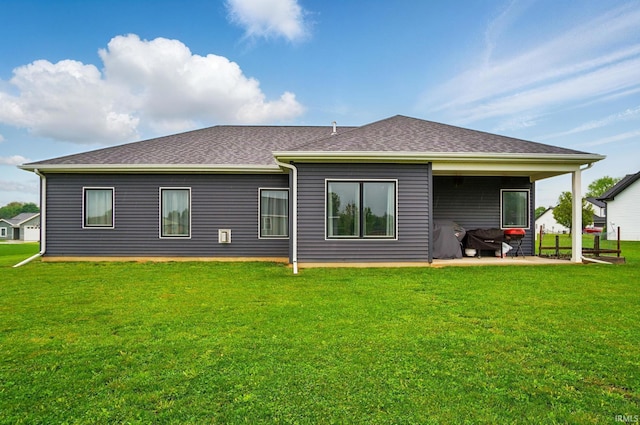 422 Westward Dr, Butler, IN 46721 - rear view of property with a yard, a patio, and roof with shingles