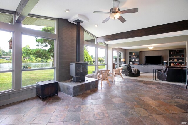 22147 Sunset Ln, Elkhart, IN 46516 - sunroom with a wood stove, beamed ceiling, and a water view
