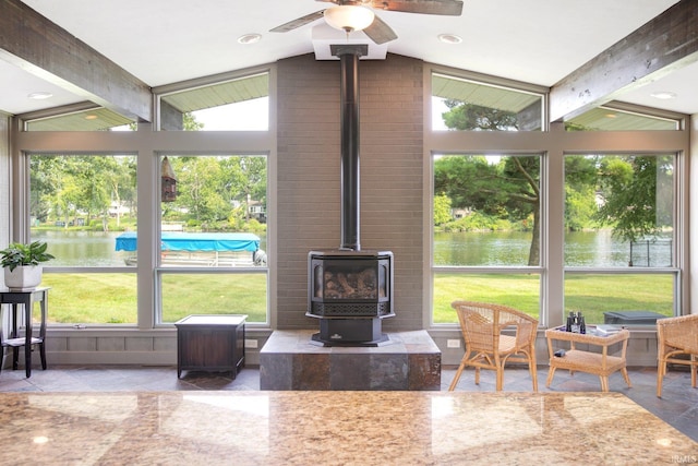 22147 Sunset Ln, Elkhart, IN 46516 - sunroom featuring a water view, a wood stove, and a ceiling fan