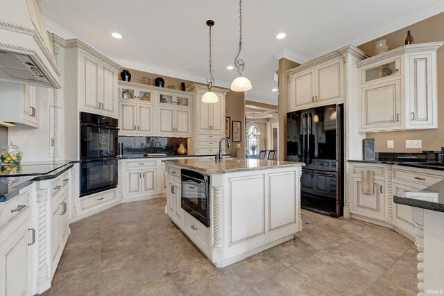 6482 Hollopeter Rd, Leo, IN 46765 - kitchen with black appliances, crown molding, an island with sink, dark stone countertops, and backsplash