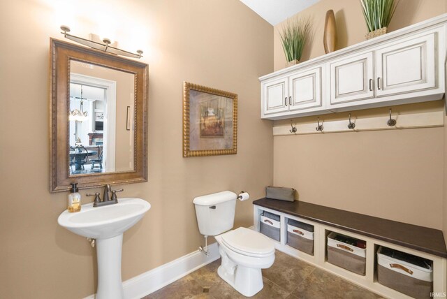 6482 Hollopeter Rd, Leo, IN 46765 - half bathroom with baseboards, toilet, tile patterned flooring, and a sink
