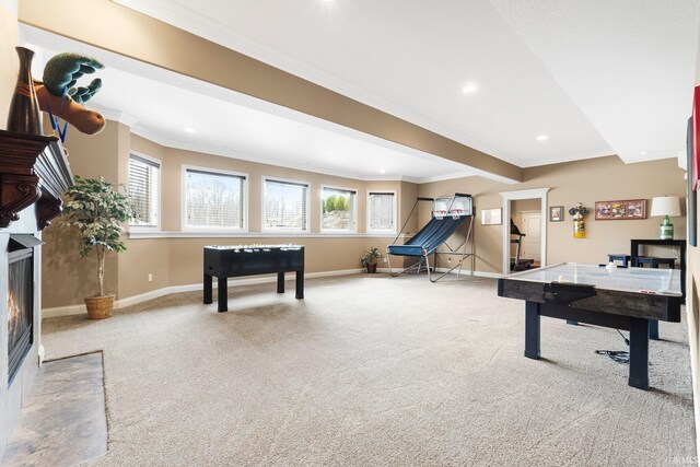 6482 Hollopeter Rd, Leo, IN 46765 - playroom with crown molding, carpet, baseboards, a fireplace with flush hearth, and healthy amount of natural light