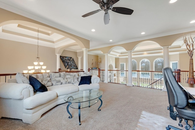 6482 Hollopeter Rd, Leo, IN 46765 - carpeted living area featuring ceiling fan, crown molding, ornate columns, recessed lighting, and arched walkways