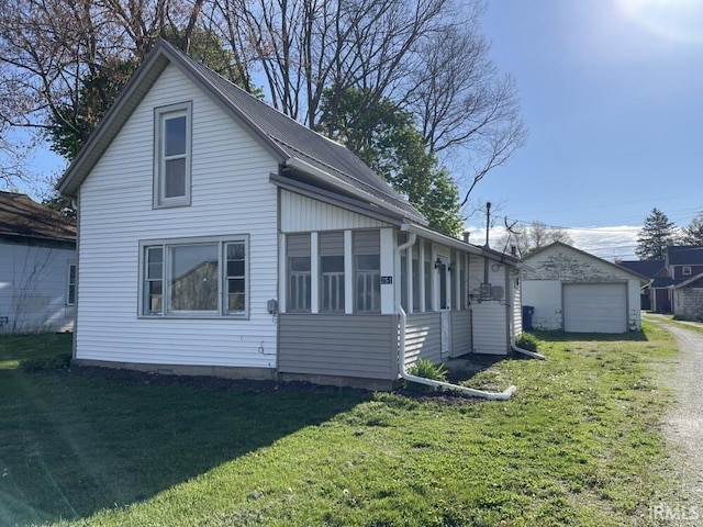 251 N Snowden St, Andrews, IN 46702 - view of front of home featuring a front lawn, a garage, and driveway