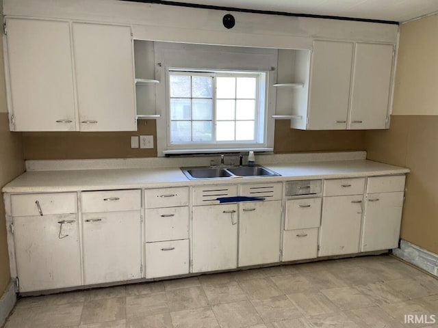 251 N Snowden St, Andrews, IN 46702 - kitchen featuring open shelves, a sink, light countertops, and white cabinets