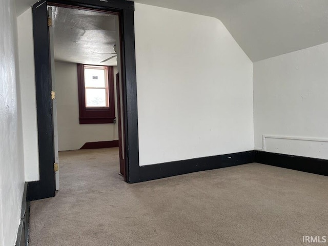 251 N Snowden St, Andrews, IN 46702 - carpeted spare room featuring vaulted ceiling