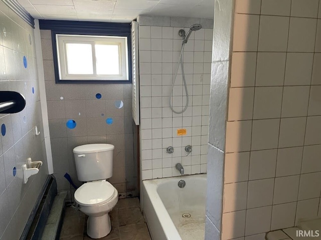 251 N Snowden St, Andrews, IN 46702 - bathroom with tile walls, toilet, tile patterned floors, and shower / tub combination