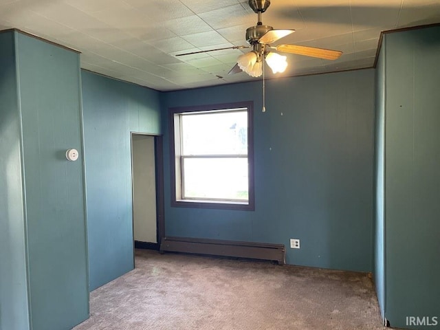 251 N Snowden St, Andrews, IN 46702 - carpeted empty room featuring baseboard heating and a ceiling fan