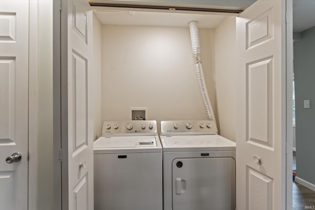 washroom with washing machine and clothes dryer