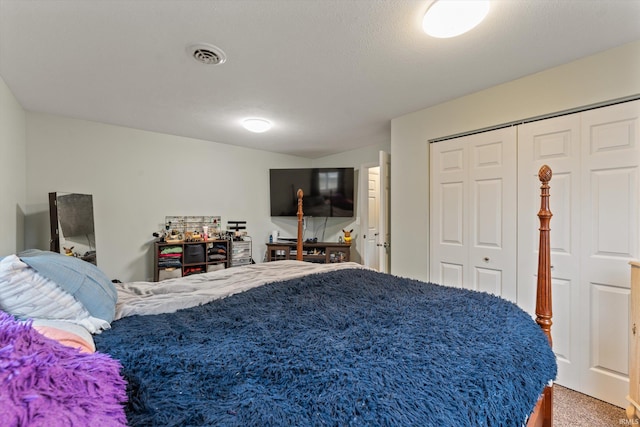 carpeted bedroom with a closet