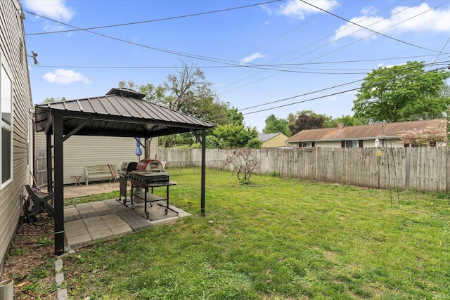 view of yard featuring a gazebo and a patio area