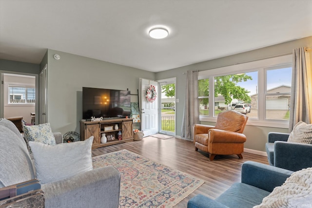 living room with wood finished floors and baseboards