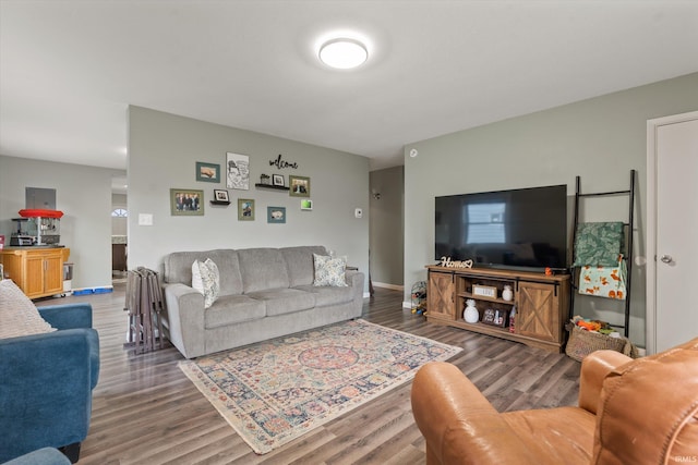 living room with wood finished floors and baseboards
