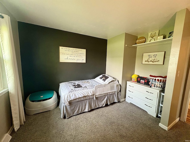 bedroom featuring carpet flooring and baseboards