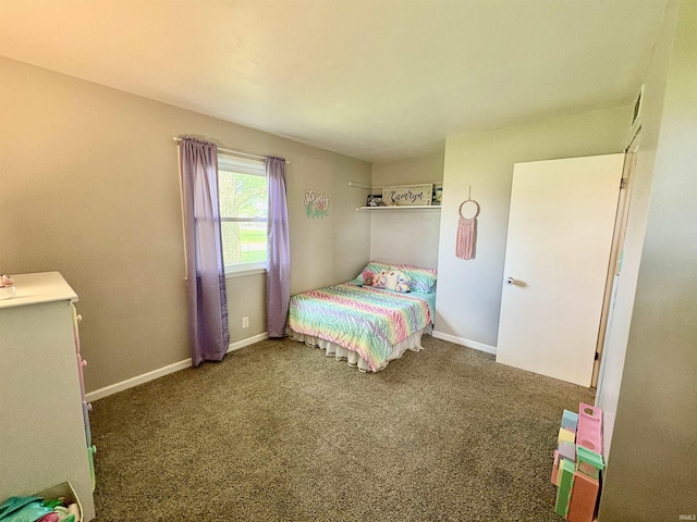 carpeted bedroom with baseboards