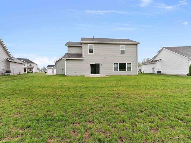 13655 Copper Strike Pass, Fort Wayne, IN 46845 - rear view of house with a yard and central AC