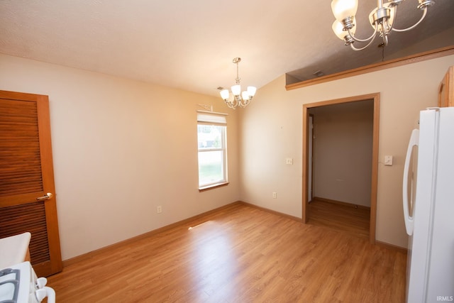 5148 Stable Dr, Lafayette, IN 47905 - unfurnished dining area featuring a chandelier, light wood finished floors, and baseboards