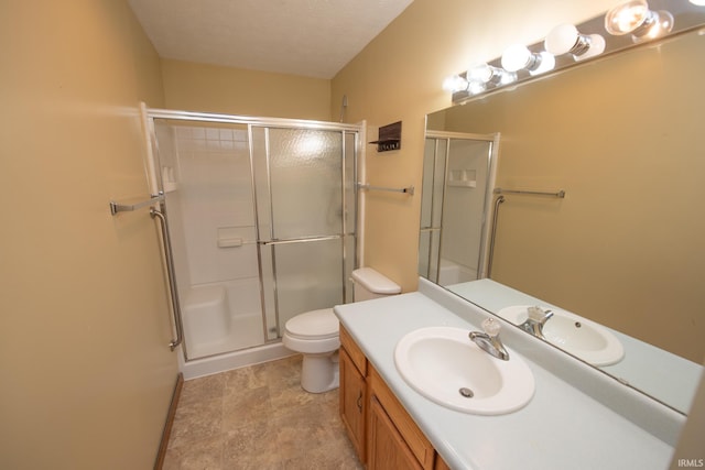 5148 Stable Dr, Lafayette, IN 47905 - bathroom featuring a shower with shower door, toilet, vanity, and baseboards