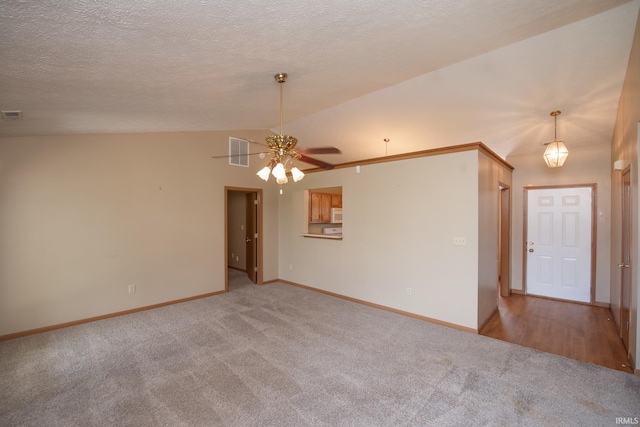 5148 Stable Dr, Lafayette, IN 47905 - carpeted empty room featuring vaulted ceiling, ceiling fan, baseboards, and a textured ceiling