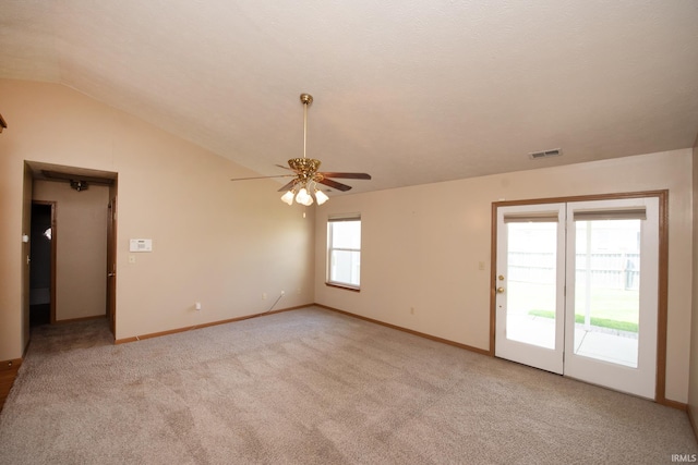5148 Stable Dr, Lafayette, IN 47905 - spare room featuring a ceiling fan, vaulted ceiling, light colored carpet, and baseboards