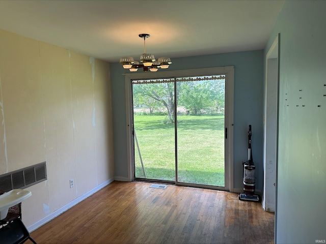 3586 E 100 S, Kokomo, IN 46902 - unfurnished dining area featuring wood finished floors, a chandelier, and baseboards