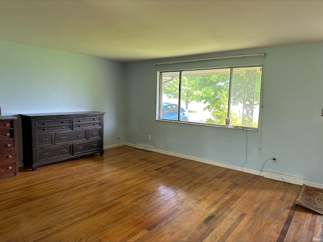 3586 E 100 S, Kokomo, IN 46902 - spare room featuring wood finished floors and baseboards