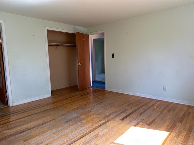 3586 E 100 S, Kokomo, IN 46902 - unfurnished bedroom featuring light wood-type flooring, a closet, and baseboards