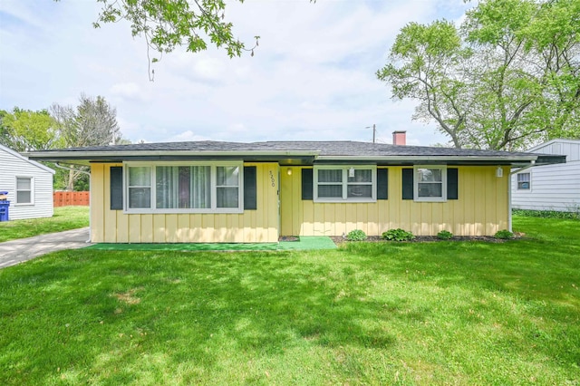 5200 Ojibway Dr, Kokomo, IN 46902 - ranch-style house featuring a chimney, a front lawn, and board and batten siding