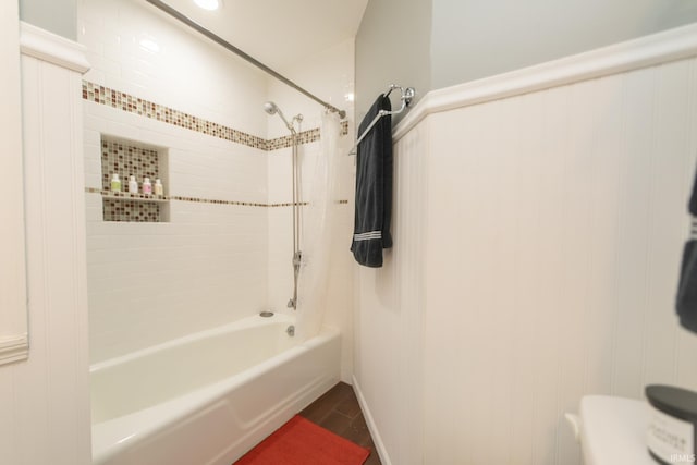 full bath featuring wood finished floors and shower / tub combination