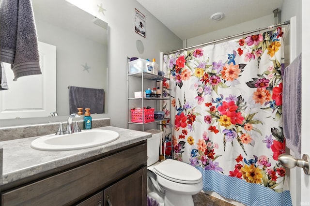 1806 Waynedale Dr, Garrett, IN 46738 - bathroom featuring toilet, vanity, and curtained shower