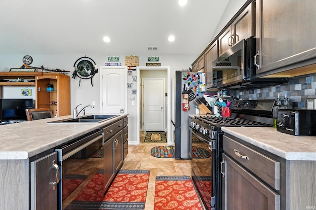 1806 Waynedale Dr, Garrett, IN 46738 - kitchen with stainless steel appliances, a sink, wine cooler, light countertops, and decorative backsplash