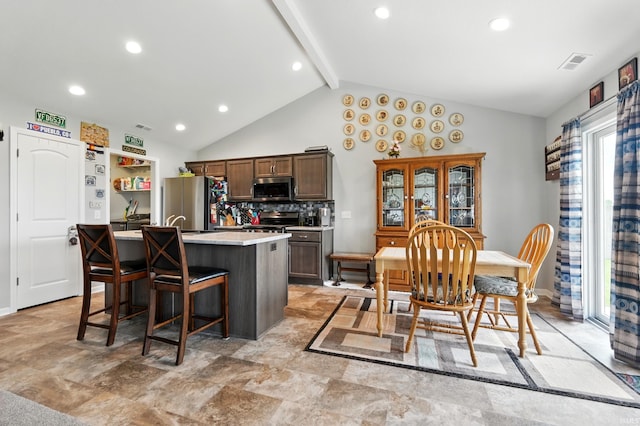1806 Waynedale Dr, Garrett, IN 46738 - kitchen with appliances with stainless steel finishes, plenty of natural light, light countertops, a center island with sink, and recessed lighting