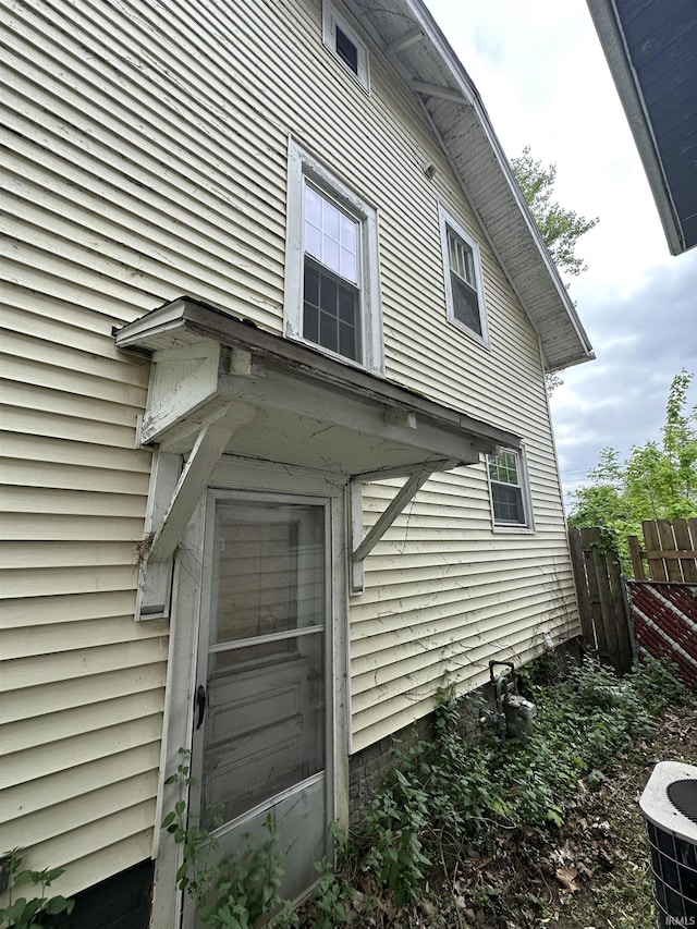 view of property exterior featuring fence
