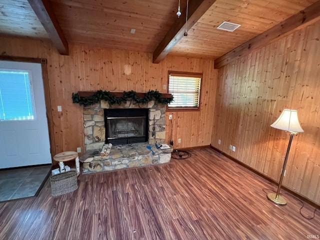 211 Mccutcheon Dr, Lafayette, IN 47909 - unfurnished living room featuring beam ceiling, wood finished floors, a stone fireplace, wood ceiling, and baseboards