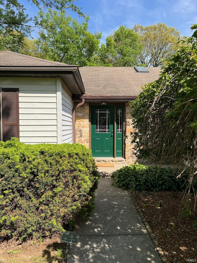 211 Mccutcheon Dr, Lafayette, IN 47909 - property entrance featuring stone siding and a shingled roof